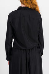 Washed fluid viscose shirt with ruffled colllar and buttonlining